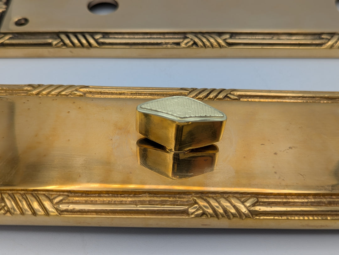 Open Box Sale Item Ribbon & Reed Oval Deadbolt Entryway Set (Polished Brass with White Porcelain Knob)